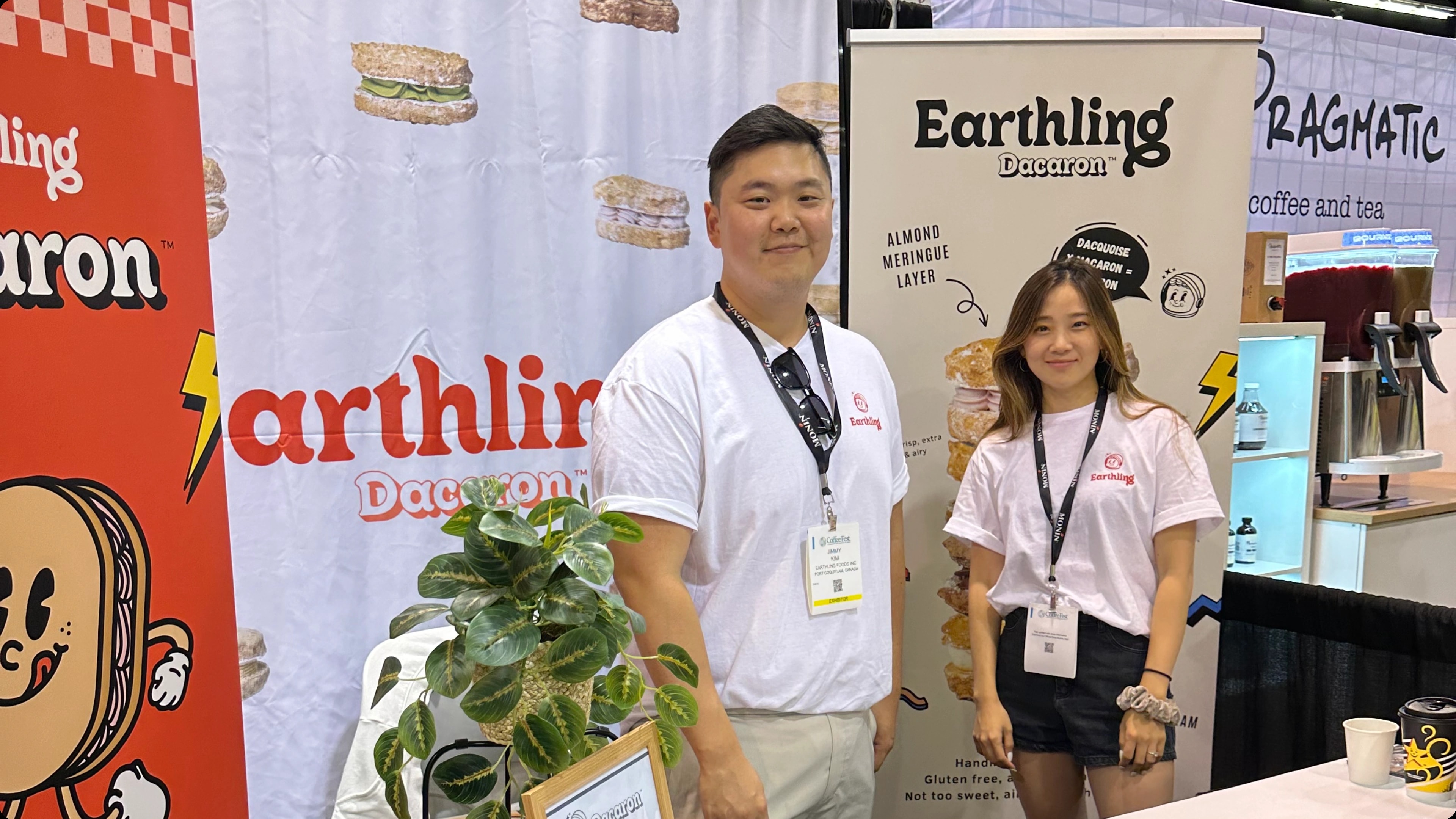 The Earthling team at a trade show booth with branded banners and backdrop