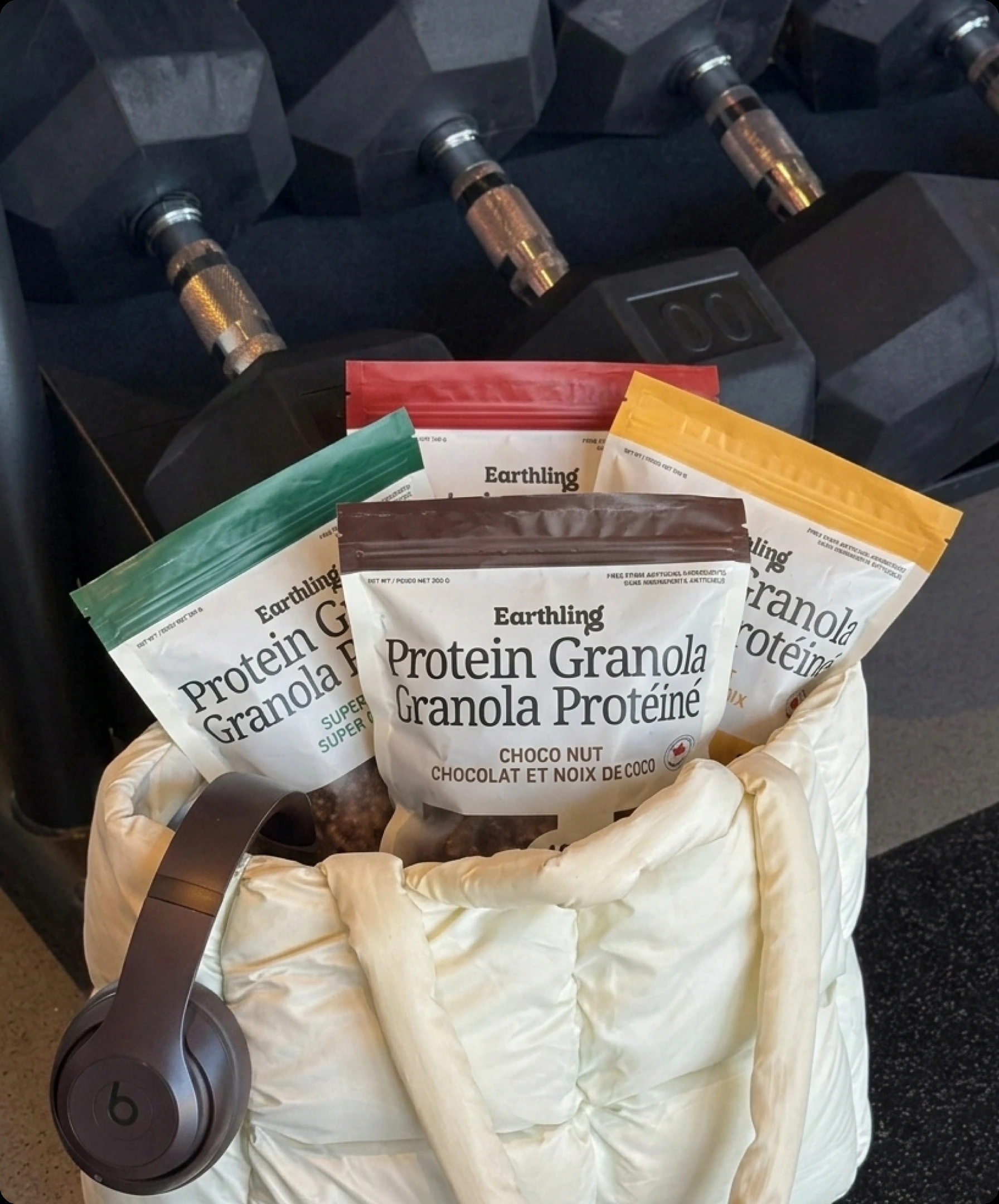 Protein granola pouches photographed in a gym bag