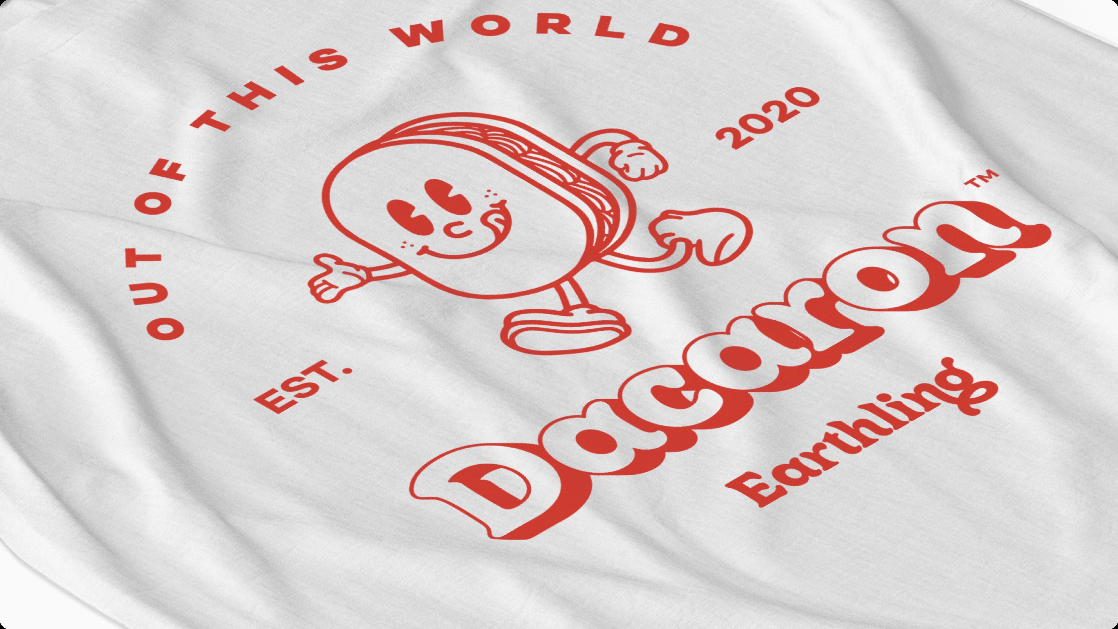 The Dacaron badge printed on a white tee