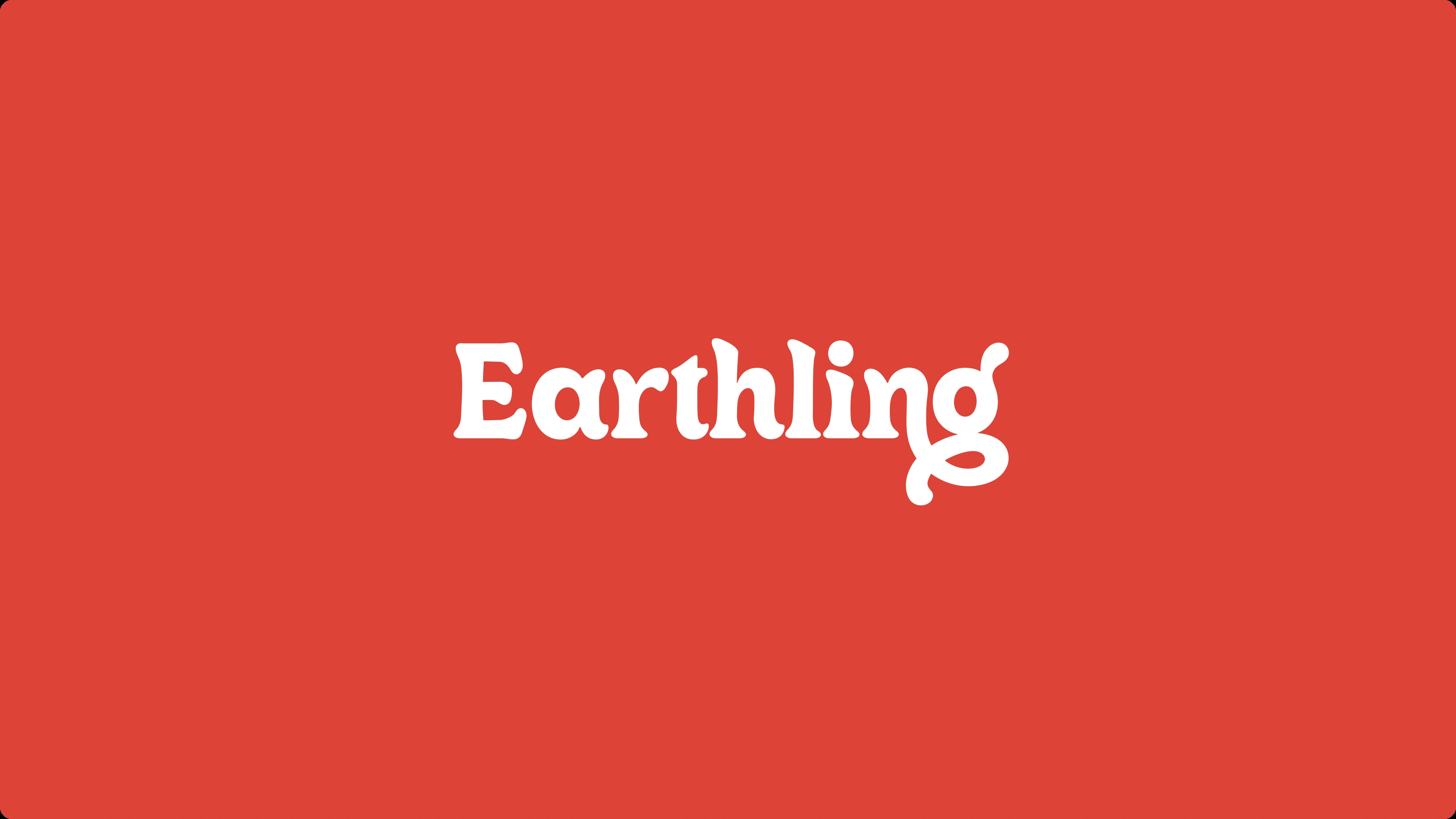 The Earthling wordmark in white on the brand red